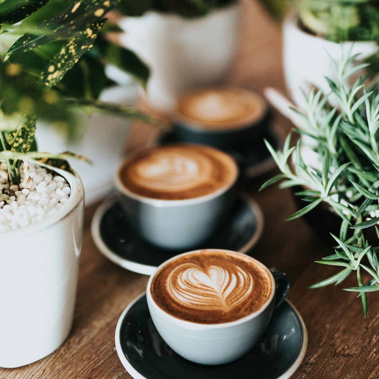 A photo of a coffee and an almond croissant